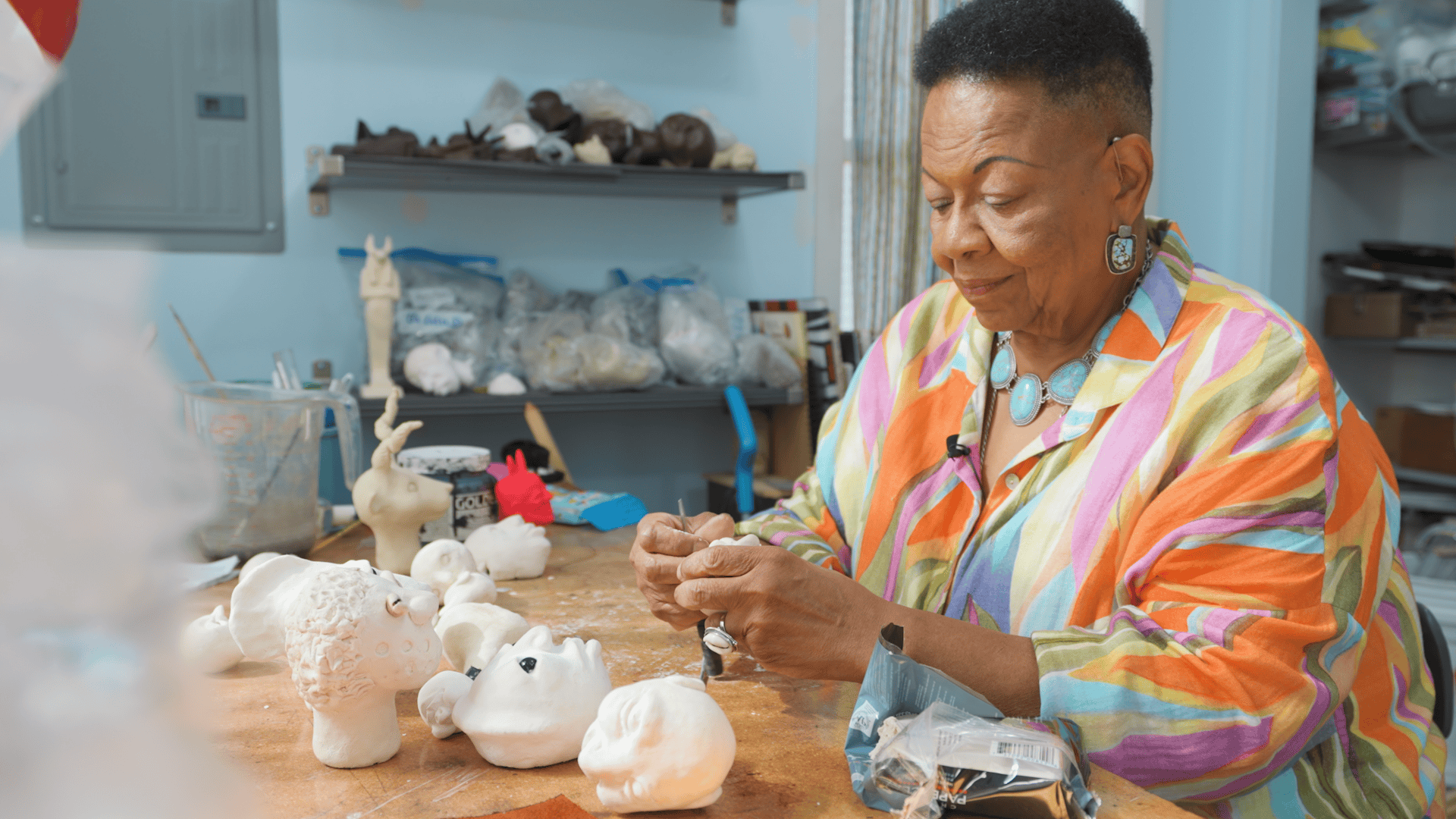 Dollmaker Kimberly Camp works in her studio.