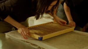 New media artist Sue Huang makes paper out of mugwort, a plant that is invasive in New Jersey.